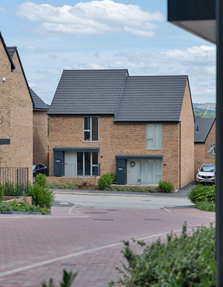An external shot of Keld, a Northstone development, with two houses next to one another from the road.